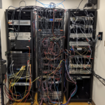 bosway2k_set_of_3_network_racks_on_the_left_in_the_MDF_network__0c0cb9f8-def2-48c0-9055-dcd7946a8cb2