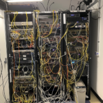 bosway2k_set_of_3_network_racks_on_the_left_in_the_MDF_network__2a5537d9-1e02-4149-941b-fccd256e28b2